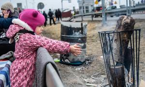 Families fleeing the escalating conflict in Ukraine arrive in Berdyszcze, Poland.