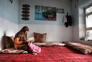 A thirteen-year-old girl studies at home in Kabul after the Taliban announced that schools would not reopen for Afghan girls in grades 7-12.
