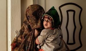 A mother and her child inside a medical clinic in Kandahar, Afghanistan.
