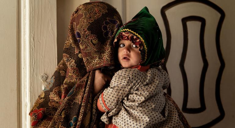 A mother and her child inside a medical clinic in Kandahar, Afghanistan.