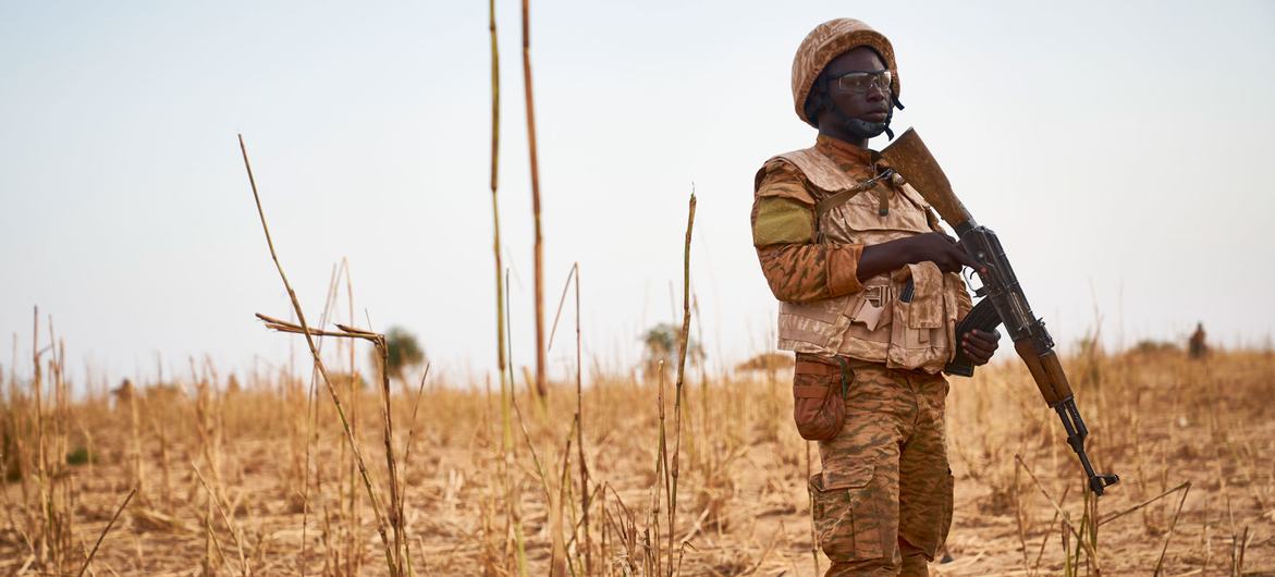 A soldier from Burkina Faso stands guard along the border with Mali and Niger during the military operation against suspected terrorists. 