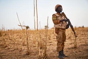 A soldier from Burkina Faso stands guard along the border with Mali and Niger during a military operation against terrorist suspects. 