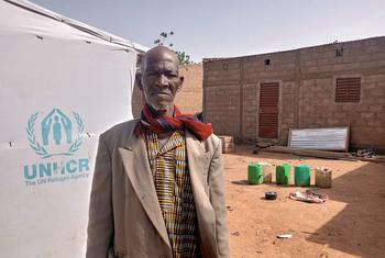 Lambda stands in his compound in the commune of Tougouri, northern Burkina Faso.