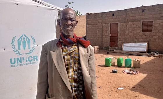 Lambda stands in his compound in the commune of Tougouri, northern Burkina Faso.