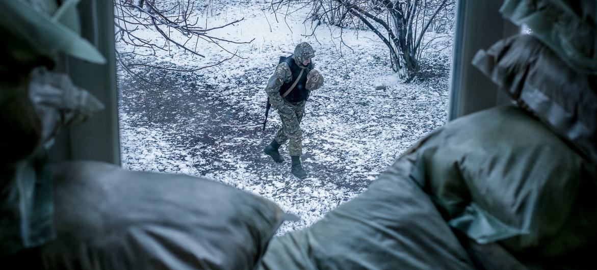 An armed police officer patrols outside a classroom in Donetsk Oblast, Ukraine. (File)