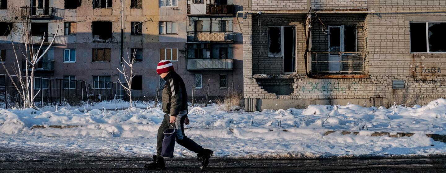 A child walks past a damaged building in eastern Ukraine. (FIle)