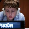 A young participant listens in to the Actions for Peace: Our Ambition for the #GlobalGoals event at UN Headquarters.