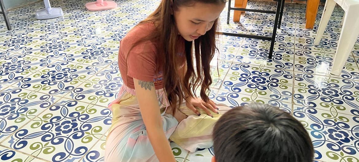 Aorn plays with her six-year-old son at the Khon Wai Sai centre.