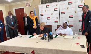 The UN High Commissioner for Human Rights Michelle Bachelet (l) and Sudan’s Minister of Foreign Affairs Asma Mohamed Abdalla sign an agreement to open a UN Human Rights Office in Sudan.  