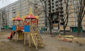 A children's playground in front of a heavily damaged residential building in Saltivka, Kharkiv. (file)