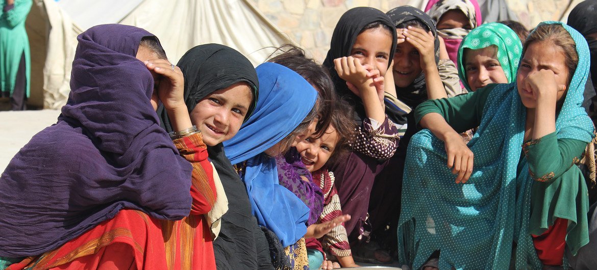 Young girls gather at a camp for displaced people in Kandahar in southwestern Afghanistan.