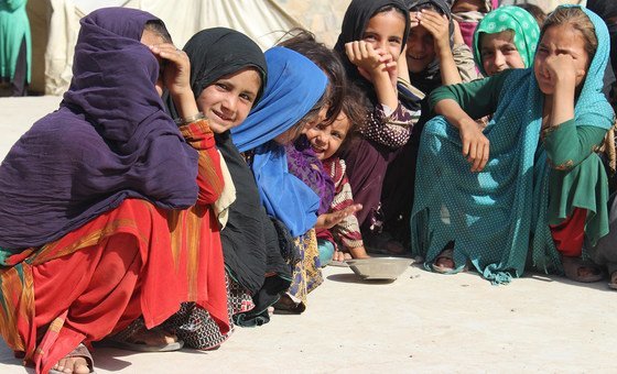 Young girls gather at a camp for displaced people in Kandahar in southwestern Afghanistan.