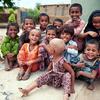 A group of children smile in Ismail Bhand village in Pakistan's Shaheed Benazirabad district, Sindh province.