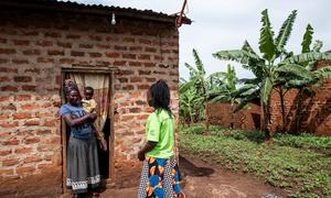 Phiona who works as a Peer Mother at the Rugaga IV Health Centre in Uganda, visits a client and her son at their home who was provided training and support to deliver HIV-free babies.