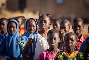 Children wait to enter their classroom at a school in Burkina Faso.