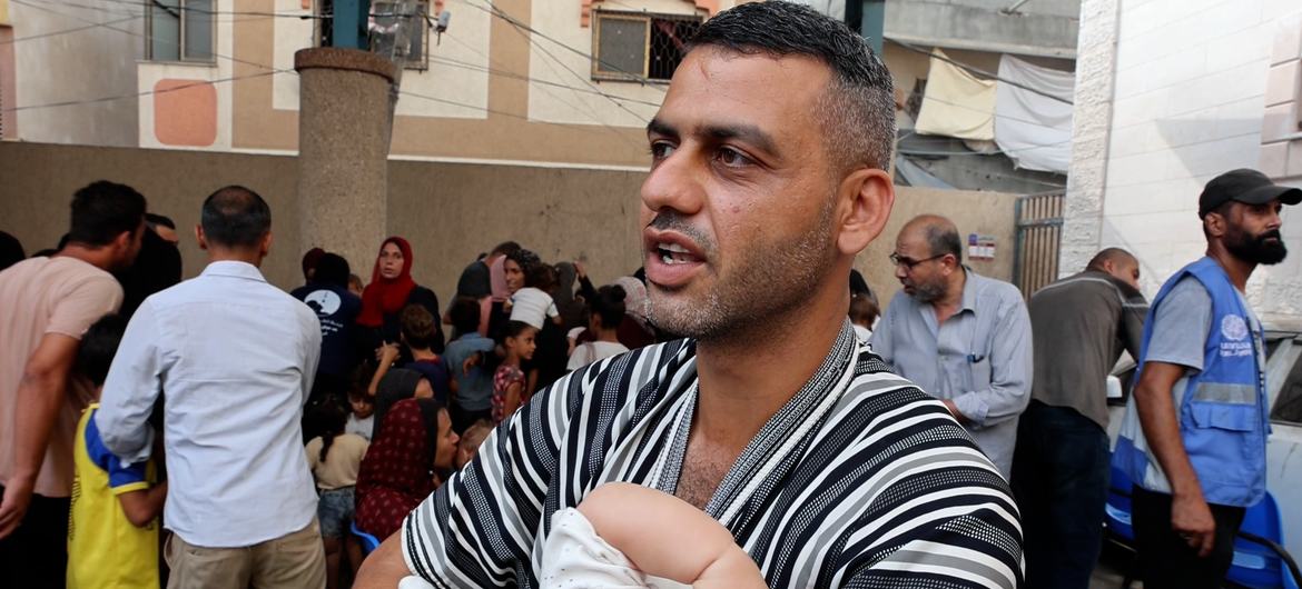 Mohamed Rajab, took his daughter to UNRWA's Deir El Bala health center to get polio vaccination. Mohamed Rajab, took his daughter to UNRWA's Deir El Bala health center to get polio vaccination.