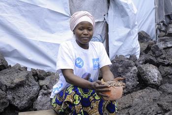 A woman in Goma, DR Congo, selling beans as a small business after receiving cash assistance from the WFP.
