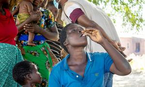 Daina Denja takes the cholera vaccine during UNICEF' cholera vaccine campaign at Misili village in Chikwawa district, Malawi.