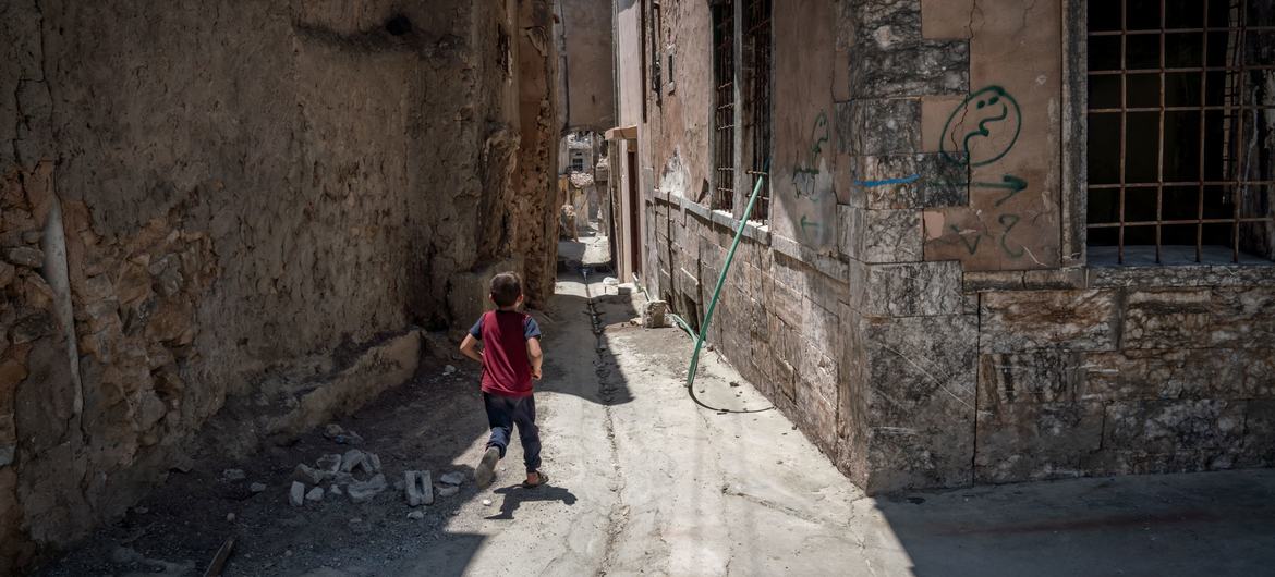 A child runs on a street in Mosul, Iraq. (file)