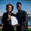 UNESCO Director-General Audrey Azoulay and Brazilian footballer Vinícius Junior, newly-appointed Goodwill Ambassador for Education for All, during a ceremony at the Real Madrid training centre.