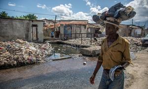 A man walks through Cité Soleil, one of the neighbourhoods of Haiti's capital, Port-au-Prince, most affected by gang violence. 