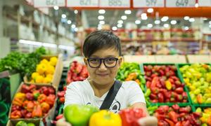 A boy in Almaty, Kazakhstan, shows some healthy eating options.