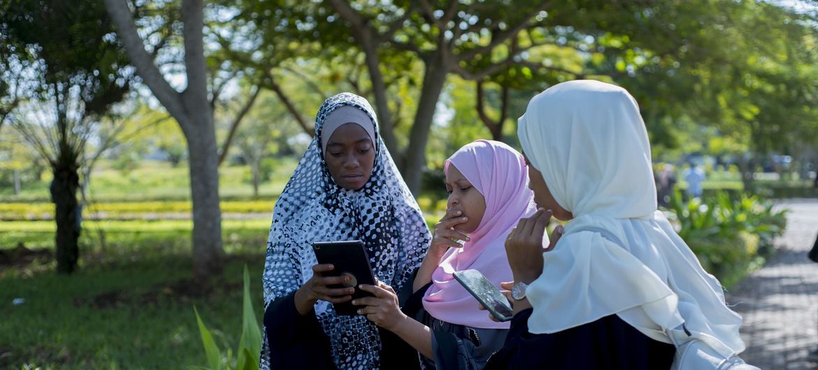 Students from the State University of Zanzibar, in Tanzania use tablets to collect data to help mapping new locations of solid waste pick up sites.