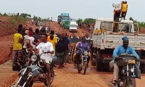 People flee the devastating floods in Mokwa, central Niger State, Nigeria.