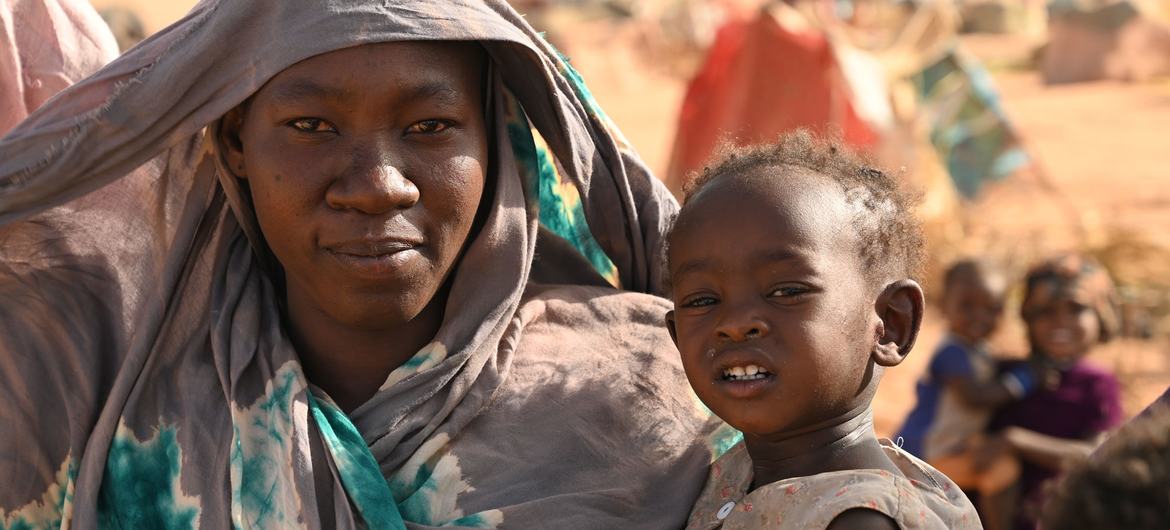 A woman and her daughter are among 180,000 Sudanese refugees waiting to be relocated from a border area in eastern Chad.