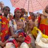 Women and children wait at a food distribution site in Adimehamedey in Tigray, Ethiopia.