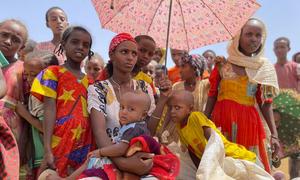 Women and children wait at a food distribution site in Adimehamedey in Tigray, Ethiopia.