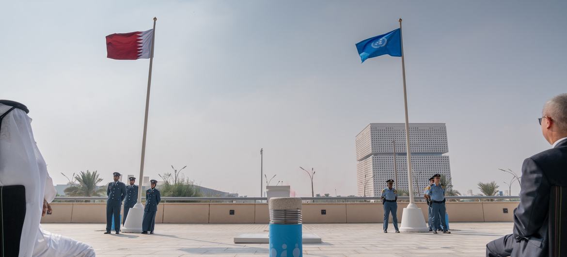 Flags of the United Nations and the State of Qatar fly at the Qatar National Convention Centre, the venue of the Second World Summit for Social Development.