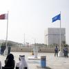 Flags of the United Nations and the State of Qatar fly at the the Qatar National Convention Centre, the venue of the Second World Summit for Social Development.