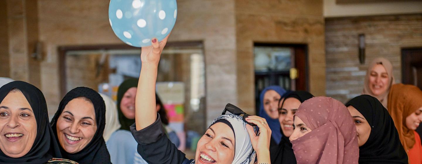 Women participate in a community empowerment session in Damascus, Syria.