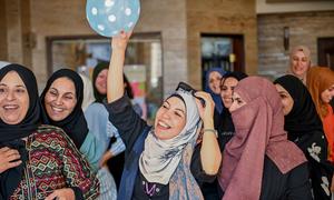 Women participate in a community empowerment session in Damascus, Syria.