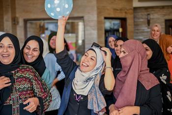 Women participate in a community empowerment session in Damascus, Syria.