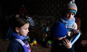 Children gather at the only heated room in their house near Ivano-Frankivsk region, Ukraine. (file)