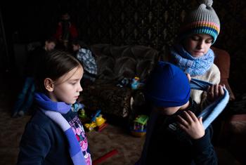 Children gather at the only heated room in their house near Ivano-Frankivsk region, Ukraine. (file)