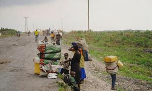 Families who had been living in displaced persons camps around Goma on their way to Shasha village in North Kivu province, DR Congo.