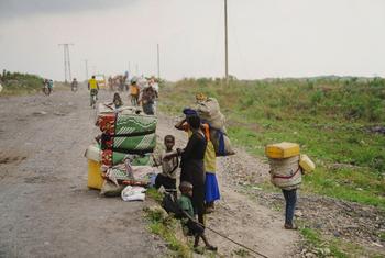 Families who had been living in displaced persons camps around Goma on their way to Shasha village in North Kivu province, DR Congo.