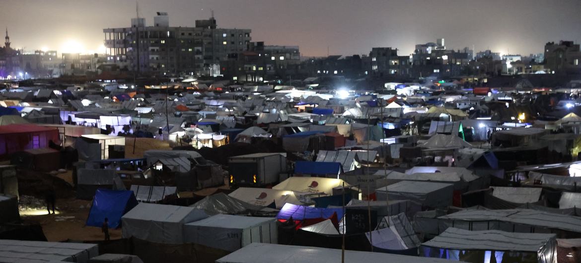 Lights illuminate the tents of displaced people in the Tal Al-Sultan neighbourhood in the south of the Gaza Strip.