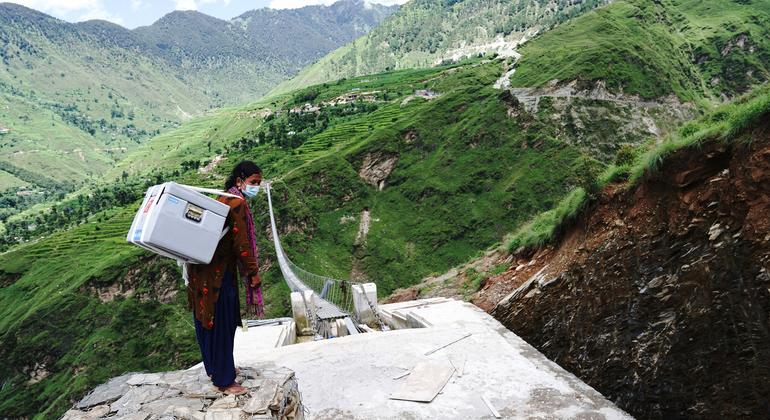 A health worker delivers COVID-19 vaccines, donated through the COVAX Facility, to a Health Post in Nepal