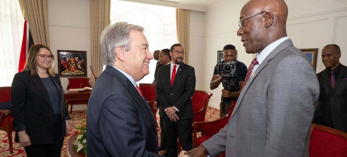 Secretary-General António Guterres (left) is greeted by Prime Minister Keith Rowley of Trinidad and Tobago where he came to address the 45th meeting of the Conference of the Heads of Government of the Caribbean Community (CARICOM).