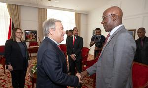 Secretary-General António Guterres (left) is greeted by Prime Minister Keith Rowley of Trinidad and Tobago where he came to address the 45th meeting of the Conference of the Heads of Government of the Caribbean Community (CARICOM).