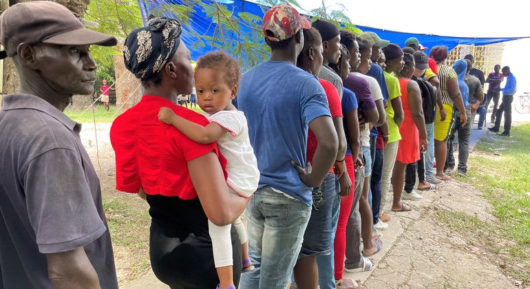 People queue to receive hygiene kits in Les Cayes, southwest of Haiti.