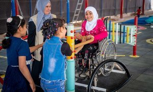 A nine-year-old child plays seesaw with her friends in an inclusive playground at her school in Za’atari Refugee Camp, Jordan.