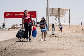 A Venezuelan family makes the long journey from the southern border of Peru to capital Lima.