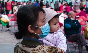 A grandmother holds her granddaughter in Shenzhen, China. (file)
