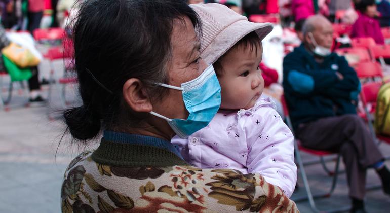 A grandmother holds her granddaughter in Shenzhen, China. (file)