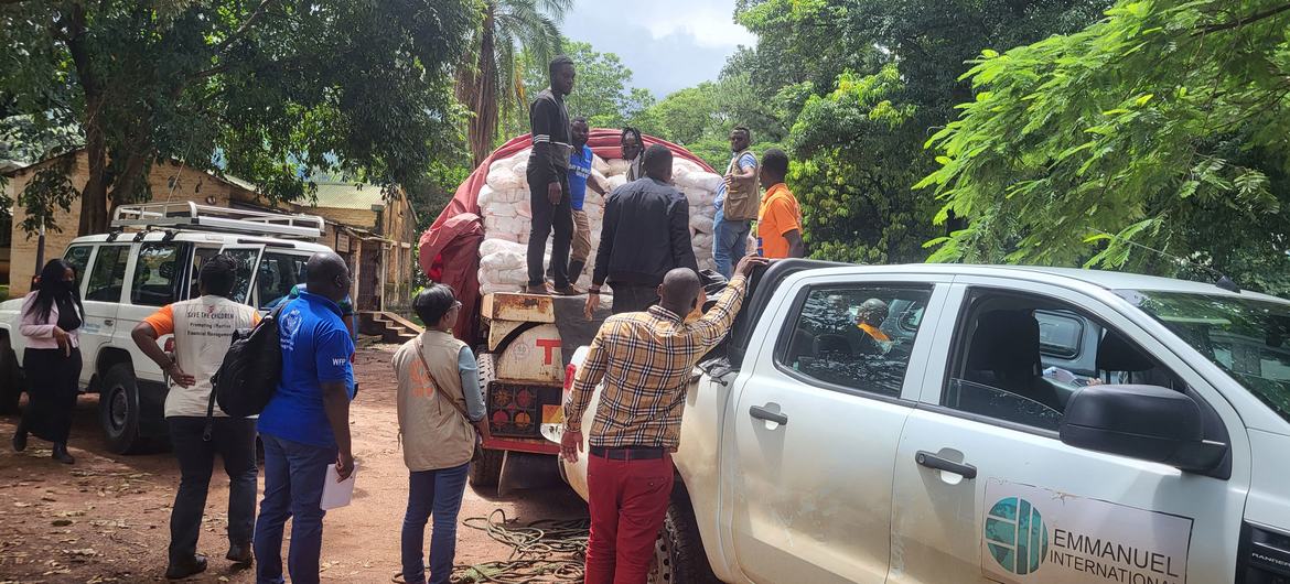 Humanitarian partners load relief items into vehicles to distribute them to different sites for the internally displaced people in Mulanje District, Malawi.